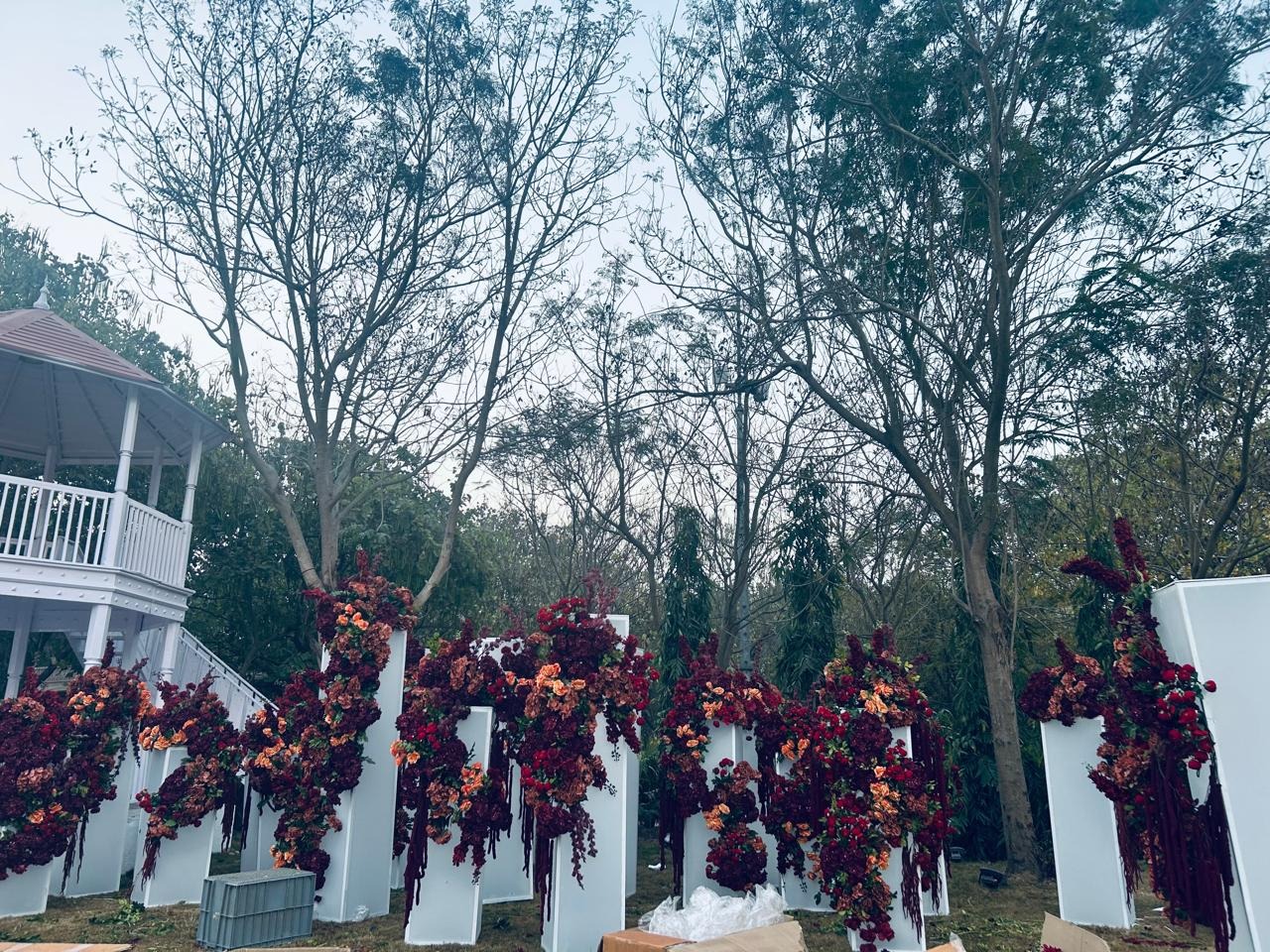 Wedding in the woods — white floral letter installations with burgundy and orange roses